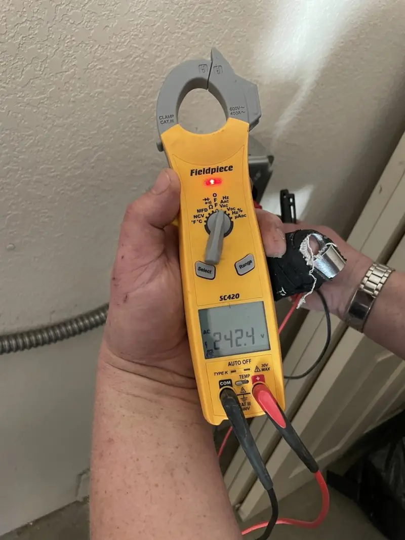 Voltage testing with clamp meter during Ceiling Fan Installation in Arkwright
